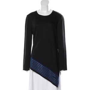 St. John black wool sweater with blue asymmetrical hem.